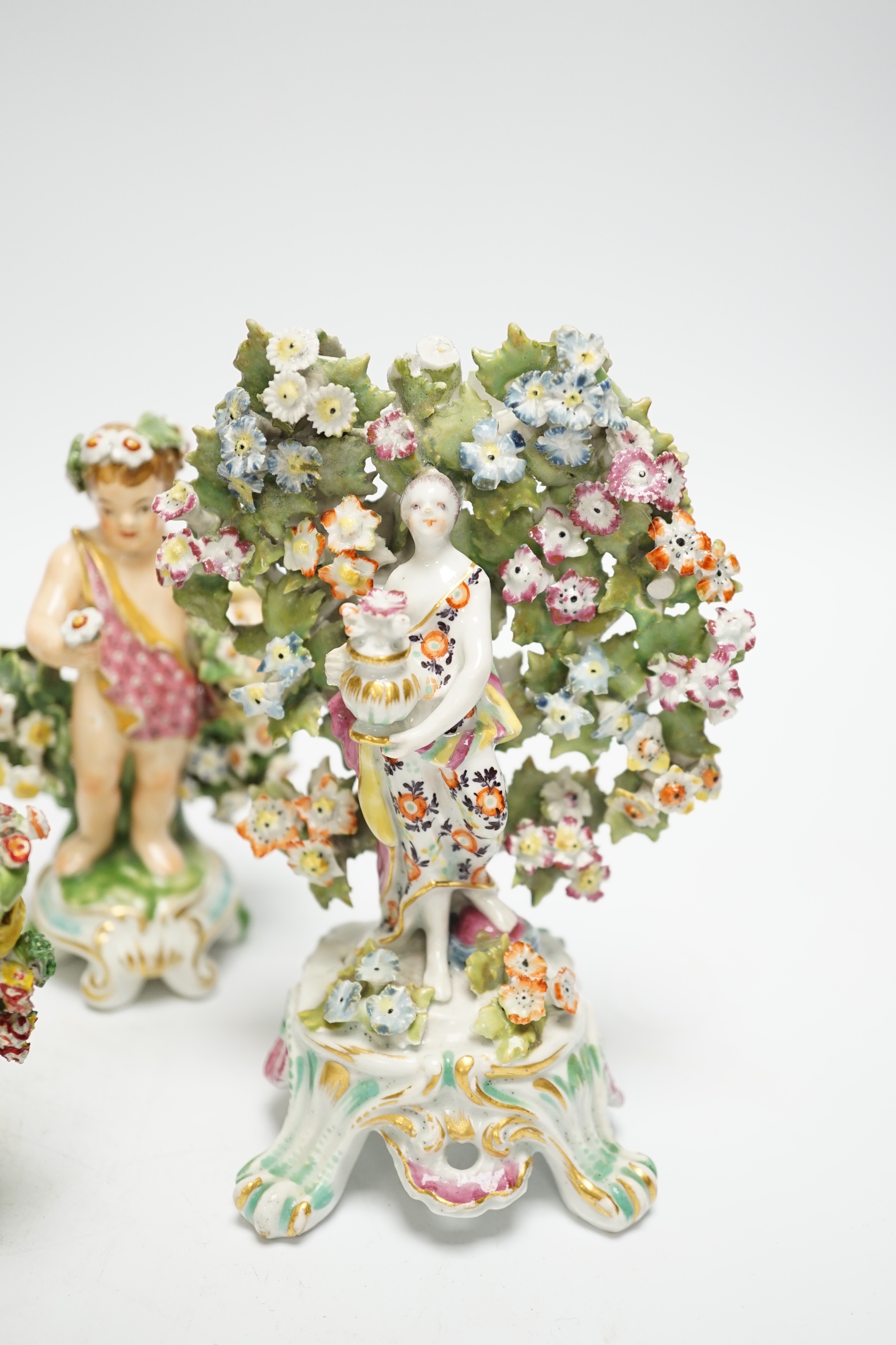 Six 18th/19th century figures by Bow and Derby, including a flower encrusted Bow figure with bocage, 15cm